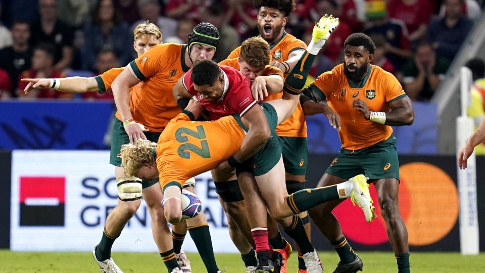 Australia's Carter Gordon is tackled by Wales' Taulupe Faletau during the Rugby World Cup 2023, Pool C match at the OL Stadium in Lyon, France. Picture date: Sunday September 24, 2023. - Photo by Icon sport