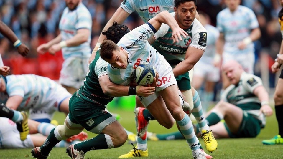 Racing 92's Juan Imhoff is tackled by Leicester Tigers' Harry Thacker and Manu Tuilagi during the European Champions Cup, Semi-Final match at The City Ground, Nottingham.